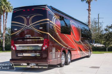 2016 Elegant Lady #5389 exterior entry side rear view of motorcoach on the lot