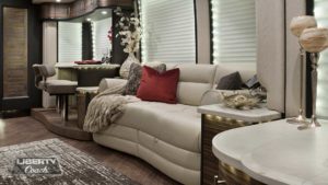 2016 Elegant Lady #5389 motorcoach interior view of side-table and sleeper sofa couch