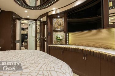 2016 Liberty Coach #5407 look front view of bedroom tv and shelves