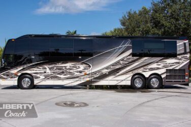 2016 Liberty Coach #5407 exterior driver side view of motorcoach on the lot