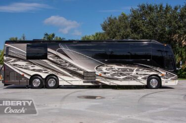 2016 Liberty Coach #5407 exterior entry side view of motorcoach on the lot