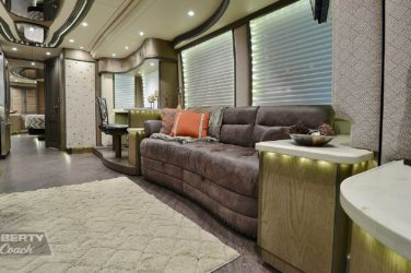 2017 Elegant Lady #5371 motorcoach interior view of side-table and sleeper sofa couch