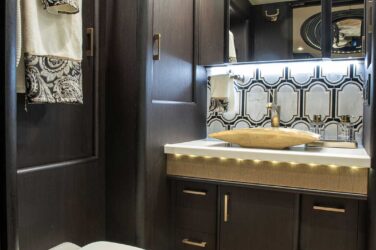 2018 Liberty Coach #897-A motorcoach interior view of bathroom vanity and vessel sink
