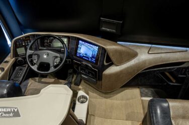 2018 Liberty Coach #897-A motorcoach interior cockpit with driver seat and dashboard area