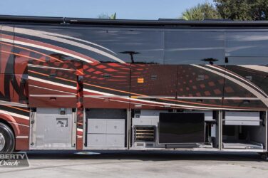 2018 Liberty Coach #897-A exterior entry side undercarriage storage bays with pull out drawers of motorcoach