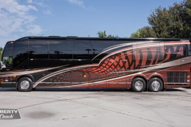 2018 Liberty Coach #897-A exterior driver side view of motorcoach on the lot