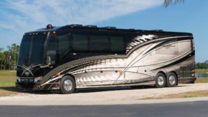 2020 Elegant Lady #860 exterior driver side view of motorcoach on the lot with slides out