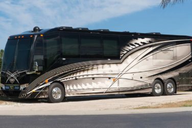 2020 Elegant Lady #860 exterior driver side view of motorcoach on the lot with slides out