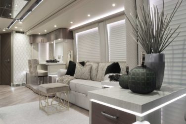 2020 Elegant Lady #860 motorcoach interior view of side-table and sleeper sofa couch