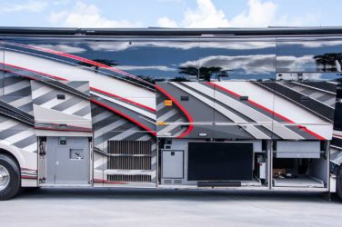 2020 Elegant Lady #7190 exterior entry side undercarriage close-up of E-Center outside bay of motorcoach