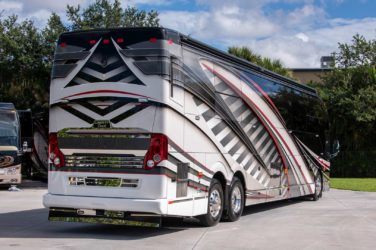 2020 Elegant Lady #7190 exterior entry side rear view of motorcoach on the lot