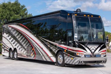 2020 Elegant Lady #7190 exterior entry side front view of motorcoach on the lot