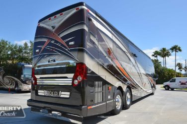 2021 Elegant Lady #5376 exterior entry side rear view of motorcoach on the lot