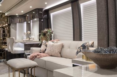 2020 Elegant Lady #863 motorcoach interior view of side-table and sleeper sofa couch