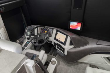 2020 Elegant Lady #864 motorcoach interior cockpit and dashboard area from behind driver’s seat