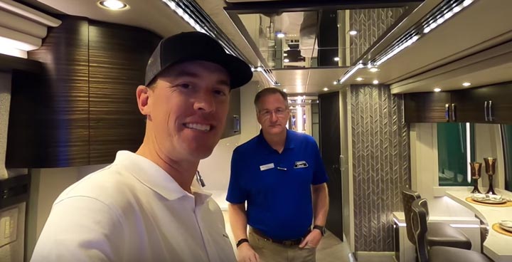 Andrew Steele and Frank Konigseder Jr. Standing Inside Motorcoach
