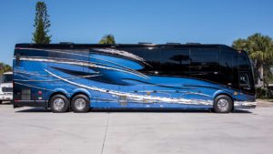 2021 Elegant Lady #866 exterior entry side view of motorcoach on the lot