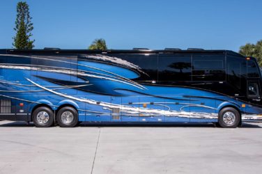 2021 Elegant Lady #866 exterior entry side view of motorcoach on the lot