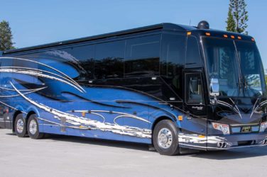2021 Elegant Lady #866 exterior entry side front view of motorcoach on the lot