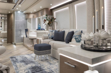 2021 Elegant Lady #866 motorcoach interior view of side-table and sleeper sofa couch