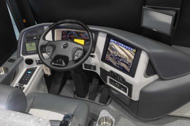 2021 Elegant Lady #869 motorcoach interior cockpit with driver seat and dashboard area