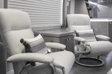 2021 Elegant Lady #869 motorcoach interior view of side chairs and table