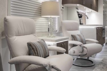 2021 Elegant Lady #870 motorcoach interior view of side chairs and table
