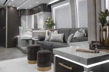 2021 Elegant Lady #871 motorcoach interior view of side-table and sleeper sofa couch