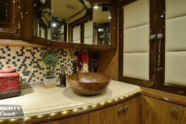 2015 Elegant Lady #5390 motorcoach interior view of bathroom vanity and vessel sink