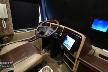 2015 Elegant Lady #5390 motorcoach interior cockpit with driver seat and dashboard area