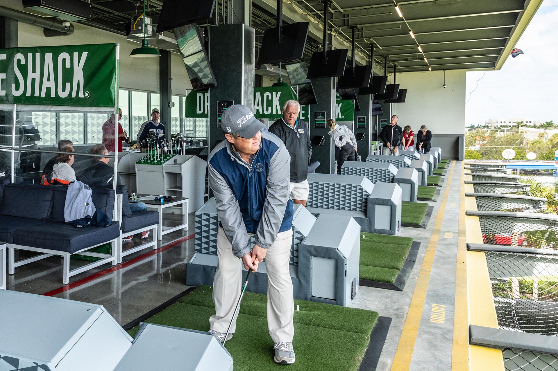 20th Annual Rally - Man Teeing up at Driving Range