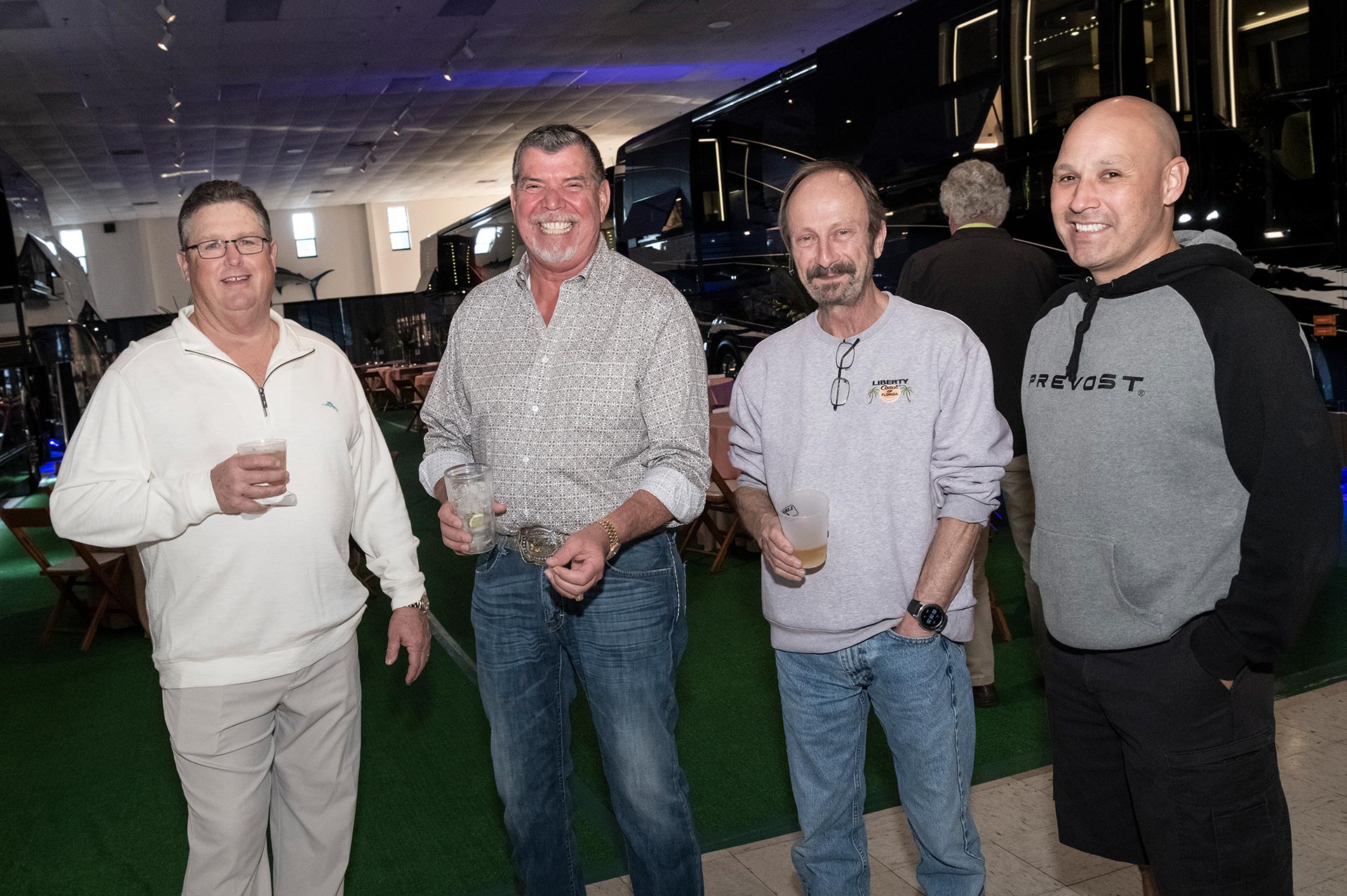 20th Annual Rally - Men Enjoying Drinks and Conversation