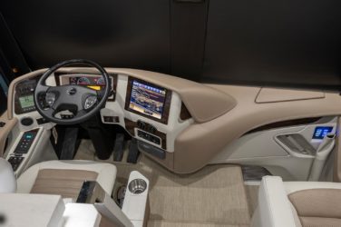 2021 Elegant Lady #876 motorcoach interior cockpit with driver seat and dashboard area
