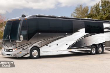 2022 Elegant Lady #880 exterior entry side front view of motorcoach on the lot