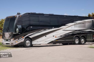 2022 Elegant Lady #881 exterior entry side front view of motorcoach on the lot