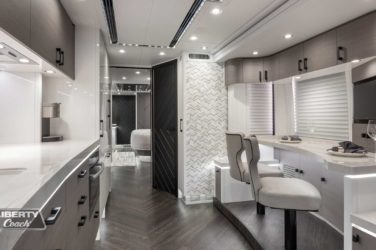 2022 Elegant Lady #883 motorcoach interior front look view of galley and dining area