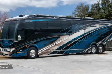 2022 Elegant Lady #884 exterior entry side front view of motorcoach on the lot