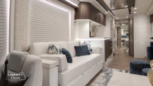 2022 Elegant Lady #884 motorcoach interior view of side-table and sleeper sofa couch