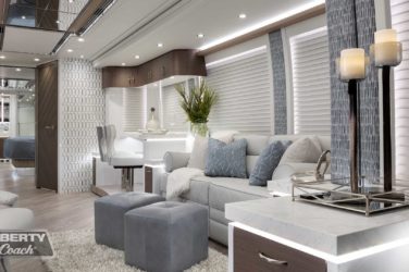 2022 Elegant Lady #885 motorcoach interior view of side-table and sleeper sofa couch