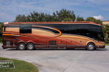 2013 Elegant Lady #5362 exterior entry side view of motorcoach on the lot