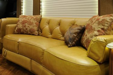 2013 Elegant Lady #5362 motorcoach interior view of side-table and sleeper sofa couch