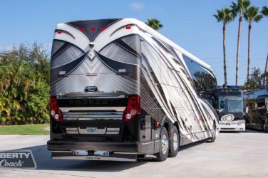2022 Elegant Lady #886 exterior entry side rear view of motorcoach on the lot