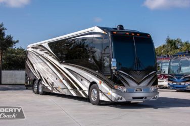 2022 Elegant Lady #886 exterior entry side front view of motorcoach on the lot