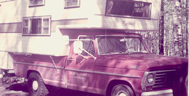 Old Pickup Truck with Camper on Top