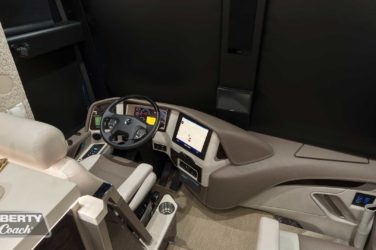 2020 Elegant Lady #7187 motorcoach interior cockpit with driver seat and dashboard area