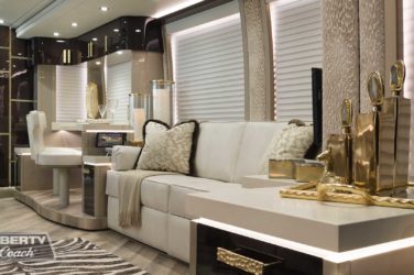 2020 Elegant Lady #7187 motorcoach interior view of side-table and sleeper sofa couch