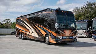 2022 Elegant Lady #888 exterior entry side front view of motorcoach on the lot