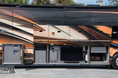 2022 Elegant Lady #888 exterior entry side undercarriage outside hot/cold spigot and storage bays of motorcoach