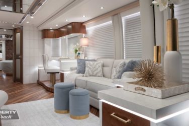 2023 Elegant Lady #893 motorcoach interior view of side-table and sleeper sofa couch