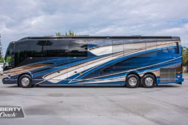 2023 Elegant Lady #894 exterior driver side view of motorcoach on the lot